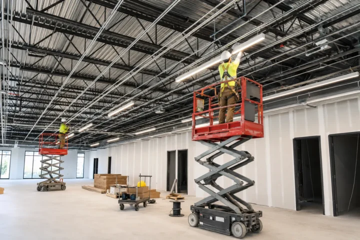 Commercial lighting installation in progress using controlled work platforms
