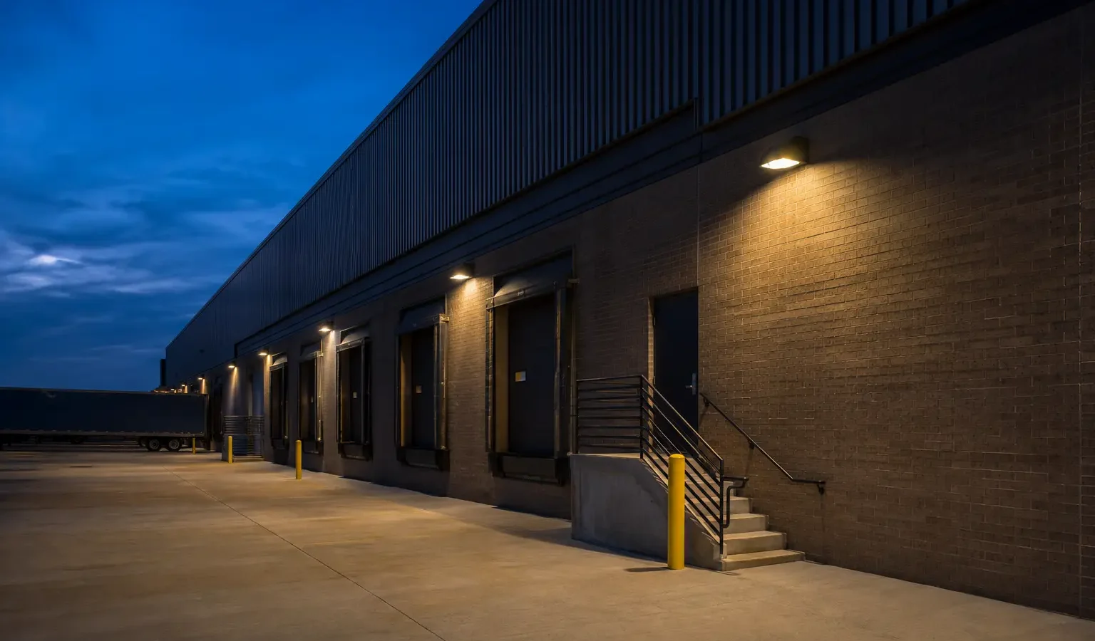 Commercial loading dock and service entrances with shielded exterior lighting